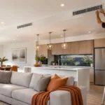 Ducted air conditioning technician installing a ceiling vent in a Melbourne home